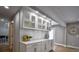 Living area with custom cabinets, white countertops, and hardwood flooring at 4395 Woodland Brook Se Dr, Atlanta, GA 30339