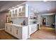 Living area with custom cabinets, white countertops, and hardwood flooring at 4395 Woodland Brook Se Dr, Atlanta, GA 30339