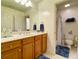 Bathroom with a vanity, shower, and toilet at 9801 Waters Edge Pointe, Villa Rica, GA 30180