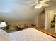 Bedroom with sloped ceilings, ceiling fan and walk-in closet at 9801 Waters Edge Pointe, Villa Rica, GA 30180