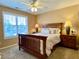 Bedroom with large window and wood furniture at 9801 Waters Edge Pointe, Villa Rica, GA 30180