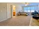 Bedroom with a sitting area, en-suite bathroom and large windows at 9801 Waters Edge Pointe, Villa Rica, GA 30180