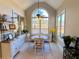 Bright breakfast nook with arched window and seating for four at 9801 Waters Edge Pointe, Villa Rica, GA 30180