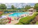 Resort-style pool with lounge chairs and umbrellas at 9801 Waters Edge Pointe, Villa Rica, GA 30180