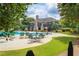Pool area with clubhouse and plenty of seating at 9801 Waters Edge Pointe, Villa Rica, GA 30180