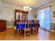 Formal dining room features hardwood floors, chandelier, and built-in hutch at 9801 Waters Edge Pointe, Villa Rica, GA 30180