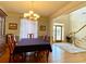 Bright dining room with hardwood floors, chandelier, and access to entry at 9801 Waters Edge Pointe, Villa Rica, GA 30180