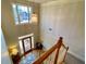 Two-story entryway with large windows, chandelier, and staircase at 9801 Waters Edge Pointe, Villa Rica, GA 30180