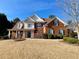 Two story brick home with large front yard at 9801 Waters Edge Pointe, Villa Rica, GA 30180