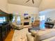 Gathering room boasts hardwood floors, fireplace, and comfortable seating at 9801 Waters Edge Pointe, Villa Rica, GA 30180