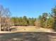 Golf course with trees and a sand trap at 9801 Waters Edge Pointe, Villa Rica, GA 30180