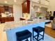 Kitchen island with seating overlooks the living area at 9801 Waters Edge Pointe, Villa Rica, GA 30180
