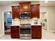 Modern kitchen with stainless steel appliances and ample cabinetry at 9801 Waters Edge Pointe, Villa Rica, GA 30180