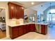Kitchen with granite countertops, stainless steel appliances, and wood cabinetry at 9801 Waters Edge Pointe, Villa Rica, GA 30180
