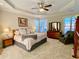 Large main bedroom with carpeted floors and seating area at 9801 Waters Edge Pointe, Villa Rica, GA 30180