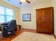 Bright home office with hardwood floors and built-in shelving at 9801 Waters Edge Pointe, Villa Rica, GA 30180