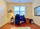 Home office featuring hardwood floors and a large window at 9801 Waters Edge Pointe, Villa Rica, GA 30180
