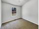 Simple bedroom with neutral walls and new carpeting at 2845 Robinson Wood Dr, Riverdale, GA 30296