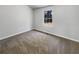 Simple bedroom with carpet and a large window at 2845 Robinson Wood Dr, Riverdale, GA 30296