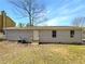 Back of house with yard and access door at 2845 Robinson Wood Dr, Riverdale, GA 30296
