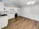 Bright kitchen with white cabinets, new flooring and modern appliances at 2845 Robinson Wood Dr, Riverdale, GA 30296
