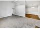 Open living room with hardwood floors and access to other rooms at 2845 Robinson Wood Dr, Riverdale, GA 30296