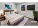 Virtually staged main bedroom with large window and TV at 2845 Robinson Wood Dr, Riverdale, GA 30296