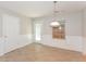 Neutral-toned dining room with tile floors and access to backyard at 2858 Vining Ridge Ter, Decatur, GA 30034