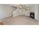 Living room with fireplace, carpet, and stairs to the second floor at 2858 Vining Ridge Ter, Decatur, GA 30034