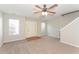 Bright living room with hardwood floor by entryway and carpeted areas at 2858 Vining Ridge Ter, Decatur, GA 30034