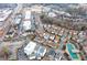 Aerial view of the neighborhood, showing homes and a pool at 360 Chambers St # 204, Woodstock, GA 30188