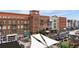 Aerial view of a brick building with shops and parking at 360 Chambers St # 204, Woodstock, GA 30188