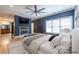 Modern primary bedroom featuring a fireplace, ceiling fan and en-suite bathroom at 1060 Morley Se Ave, Atlanta, GA 30312