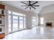 Large living room featuring tile floors, fireplace, built-in microwave, and French doors leading to the yard at 1060 Morley Se Ave, Atlanta, GA 30312