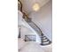 Elegant staircase with dark wood and iron railing, complemented by a crystal chandelier at 1060 Morley Se Ave, Atlanta, GA 30312