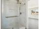 Elegant bathroom with marble shower and glass enclosure at 1111 Park Nw Cir, Conyers, GA 30012