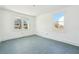 Spacious bedroom with two bright windows and gray flooring at 1111 Park Nw Cir, Conyers, GA 30012