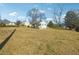 View of the home from the side yard at 1111 Park Nw Cir, Conyers, GA 30012