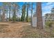 Large backyard with mature trees and a shed at 4223 Welbron Dr, Decatur, GA 30035