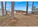 Spacious backyard with a brick house in the background at 4223 Welbron Dr, Decatur, GA 30035