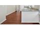Modern kitchen with white cabinets, granite countertops, and hardwood floors at 4223 Welbron Dr, Decatur, GA 30035