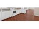 Modern kitchen with white cabinets, granite counters, and hardwood floors at 4223 Welbron Dr, Decatur, GA 30035