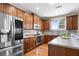 Modern kitchen with stainless steel appliances and ample counter space at 7400 Bronson Way, Cumming, GA 30041