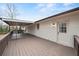 View of large back deck made of wood, offering plenty of outdoor space and convenient access to the house at 3308 Wildwood Sw Dr, Marietta, GA 30060