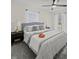 Bright bedroom with plush pillows, flowers, and ceiling fan for added comfort at 3308 Wildwood Sw Dr, Marietta, GA 30060