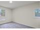 Bright, minimalist bedroom with neutral walls and large windows allowing ample light at 3308 Wildwood Sw Dr, Marietta, GA 30060