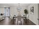 Elegant dining room with a modern chandelier and a view of the outdoors, perfect for Gathering meals at 3308 Wildwood Sw Dr, Marietta, GA 30060