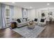 Comfortable living area featuring hardwood floors, ample seating, and stylish decor for a cozy atmosphere at 3308 Wildwood Sw Dr, Marietta, GA 30060