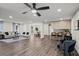 Spacious, open living area with hardwood floors seamlessly connecting the living room, dining, and kitchen at 3308 Wildwood Sw Dr, Marietta, GA 30060