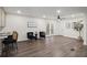 Bright living room with hardwood floors, a ceiling fan, and double doors to the outside at 3308 Wildwood Sw Dr, Marietta, GA 30060